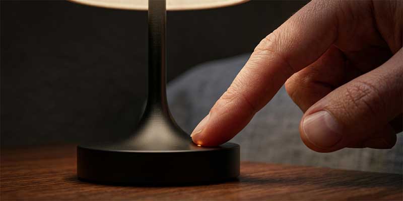 Modern table lamps for living room showing capacitive stepless touch dimming functionality on a solid metal base.