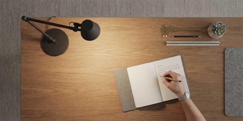 Desk lamp placement for right and left handed writing